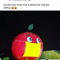 A social media post featuring a large apple with a mask.