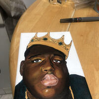 This is a picture of a drawing made of a black man wearing a crown.