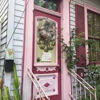 A pink door with a poster on it.