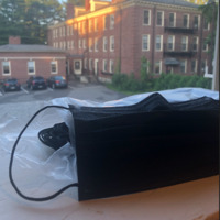 This is a picture of a stack of black face masks.