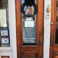 The door of Snug Harbor, a music venue on Frenchmen Street in New Orleans, LA, is hung with a black mourning wreath to mark the death of Ellis Marsalis, beloved pianist and music educator.