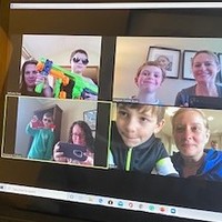 A zoom meeting between multiple people.