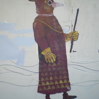 A mural of a plague doctor.