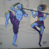 A mural with two people exercizing.