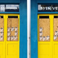 Art of toilet paper on two doors.