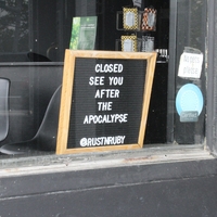 A business sign reading "Closed. See you after the apocalypse".