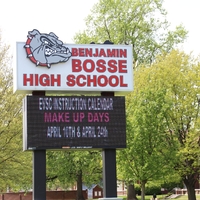 A school sign reading "EVSC Instruction Calendar Make Up Days April 10th and April 24th".