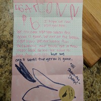 A pink letter with pink writing on it.